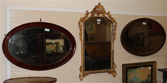 A gilt marginal mirror and two oval mahogany mirrors